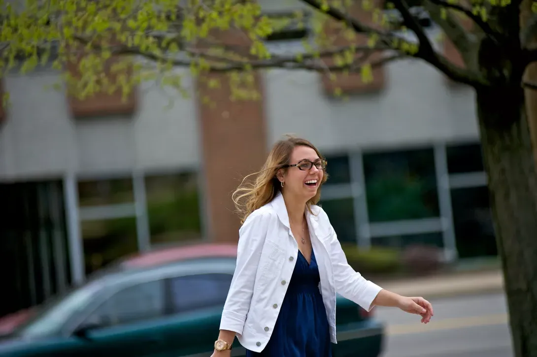 Female student walking along Claremont Avenue